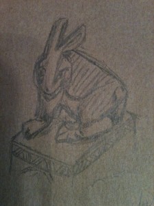 A sketch of a rabbit, done in pencil on brown paper