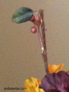 Photo of a fake twig and flower petals