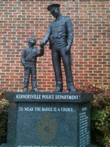 A statue of a police officer holding a little boy's hand